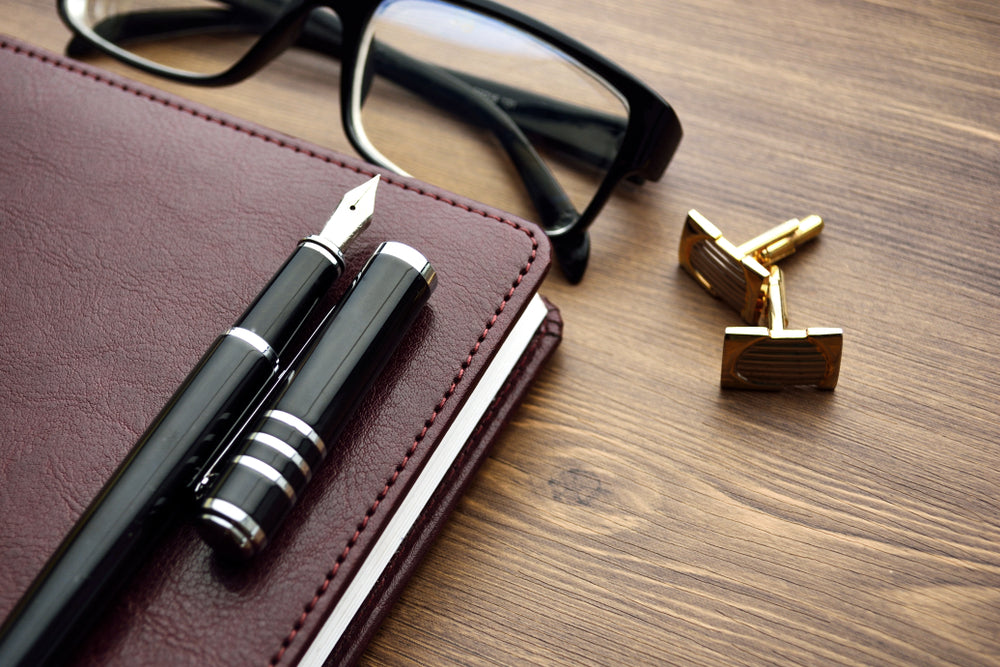 diary, fountain pen, glasses.