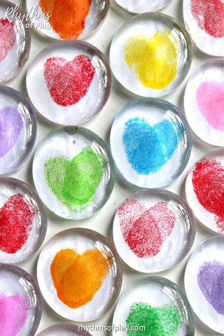 Homemade glass magnets with rainbow thumbprints