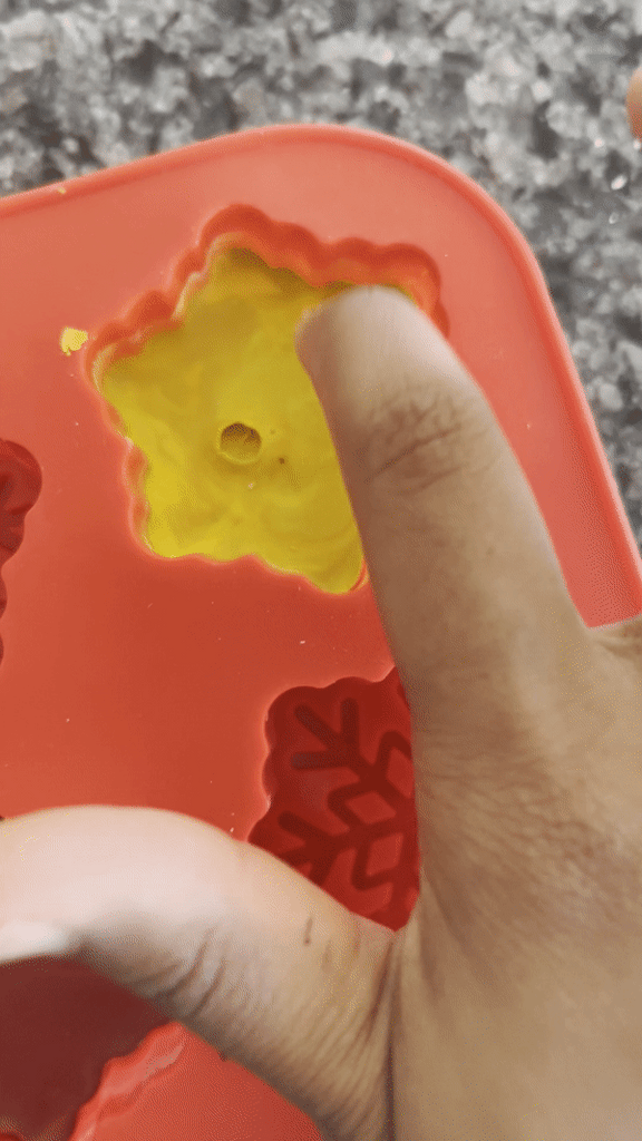 GIF of hardened crayon wax in a snowflake mold