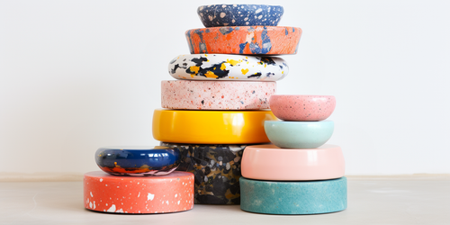 a beautiful pile of setinstone cast bowls and trinket dishes in many colors