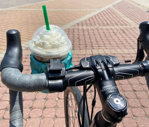 Commuter bike with coffee in a cup holder