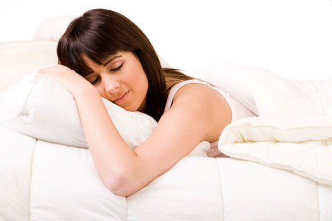 Put in the time when breaking in a new mattress, woman sleeping in warm bed