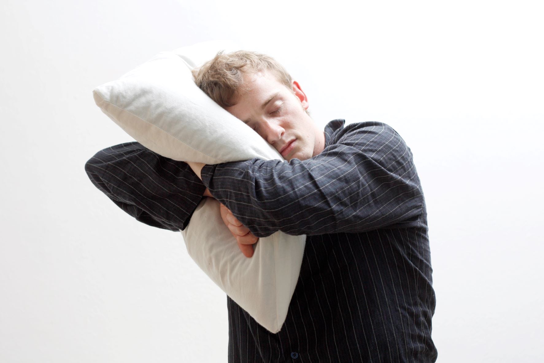 Helping A Sleepwalker Without Waking, man sleep walking while hugging a pillow