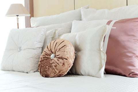 Plenty of pillows on hotel bed