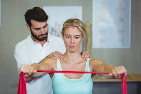 Physical therapy for shoulder pain at night, woman getting physical therapy session for her shoulder