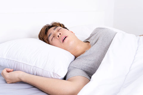 man in deep sleep with open mouth