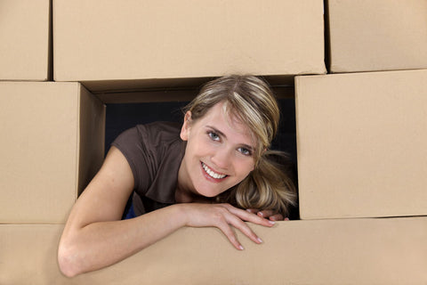 Woman in cardboard fort