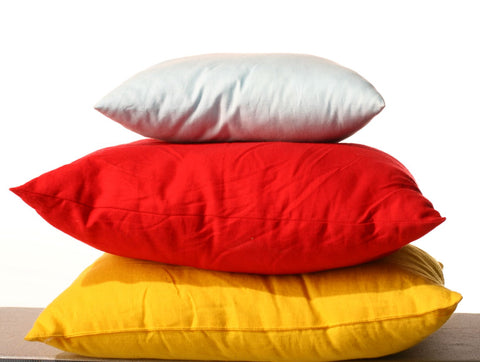 What is a decorative pillow? Pile of different pillows