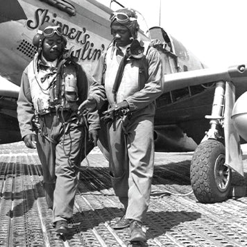 Tuskegee airmen in front of the P-51 Mustang