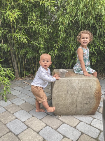 Esteemed Motherhood Coach, Cathy Wojcik's Children snack with an Eizzy Baby Snack Cup