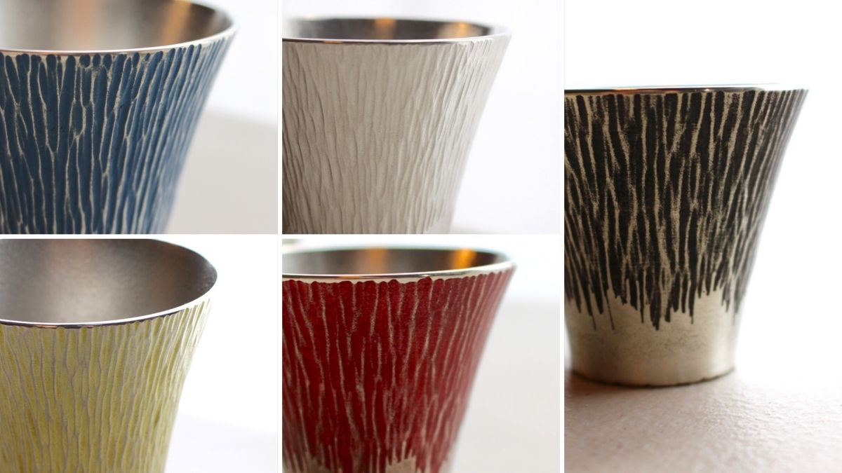 Tin tumblers in five colors, each full of character