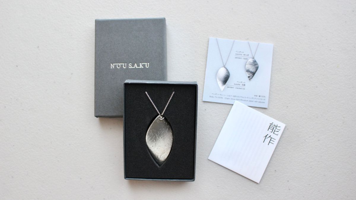 Tin pendant in a special box for convenient storage