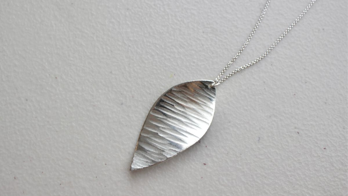 Traditional craft pendant with a beautiful shine made of 100% tin