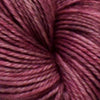 Close up view of a pinky red yarn skein