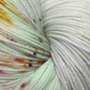 close up of pale grey yarn with teal and yellow and some sprinkles of rust red and dark grey