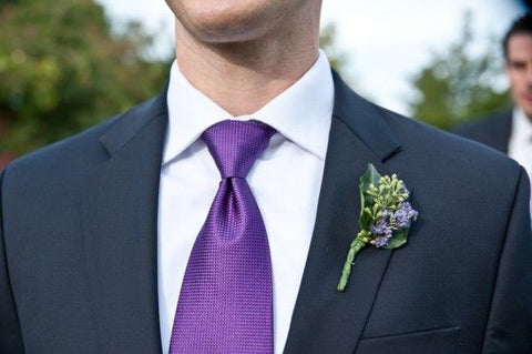 black suit with purple tie