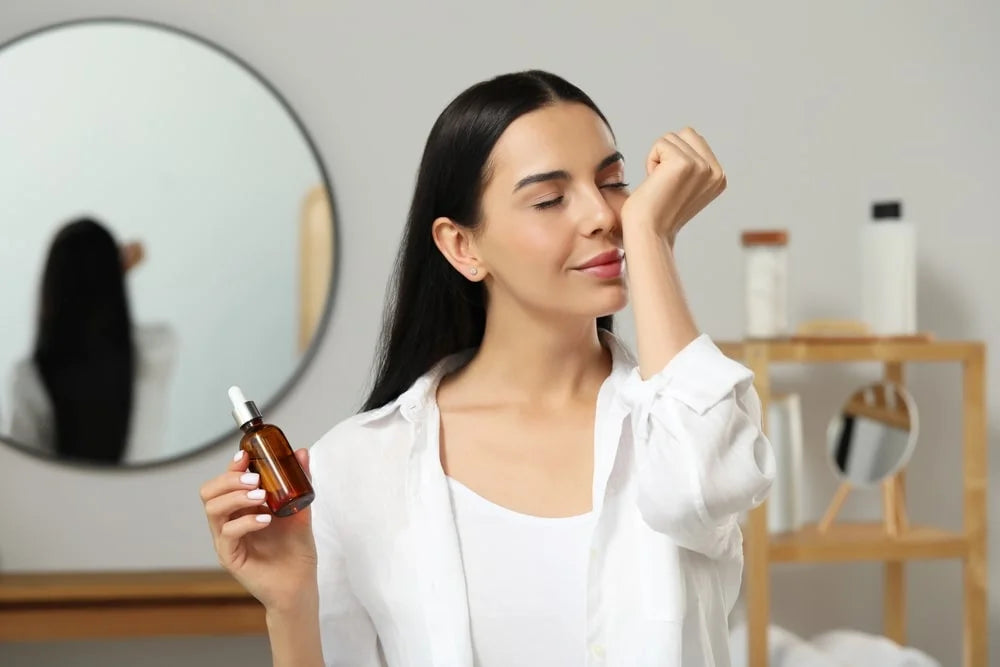 Young Woman Smelling Essential Oil