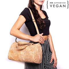 Woman carrying a vegan cork leather handbag on her shoulder