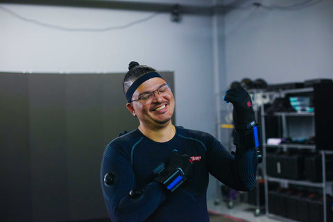 Sign Language translator smiling while wearing a Perception Neuron Studio Motion Capture Suit
