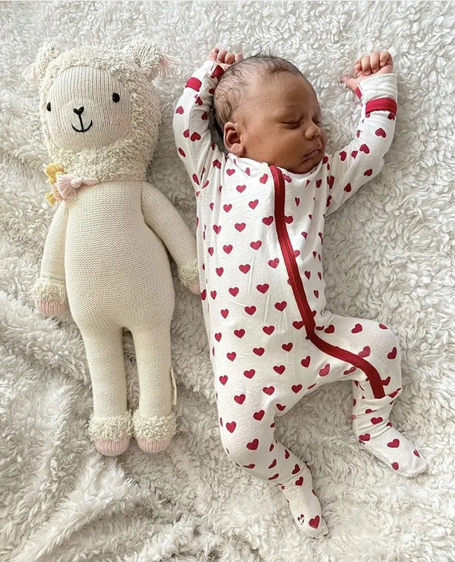 Baby in a heart covered onesie