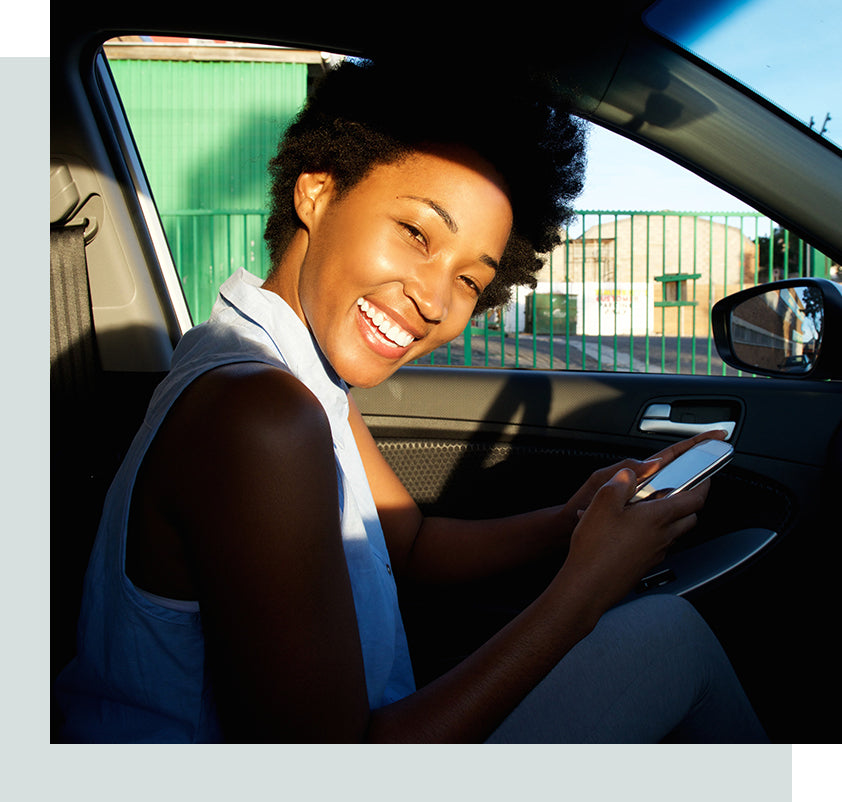 Image of a woman driving her car.