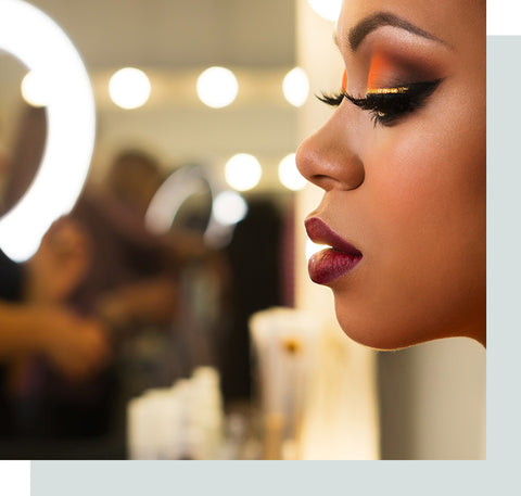 Close-up portrait of woman wearing makeup.