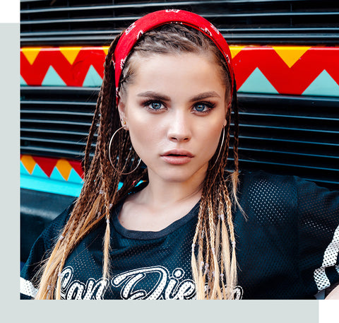  Young woman with bandana and long braids.