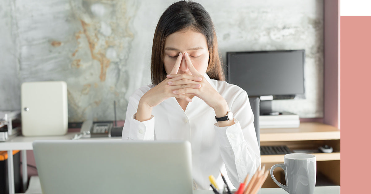 You professional woman working from home looking exhausted