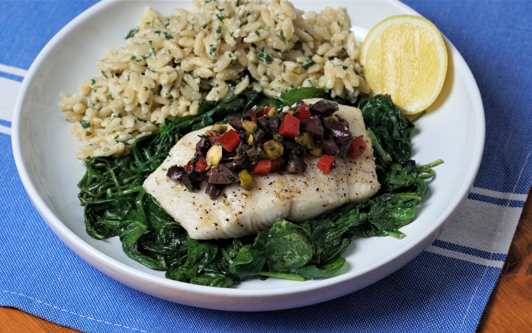 Baked White Fish with Spinach, Kalamata Gremolata, and Savory Herbed Orzo Pilaf_image