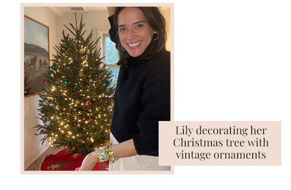 Lily decorating her christmas tree with Vintage ornaments