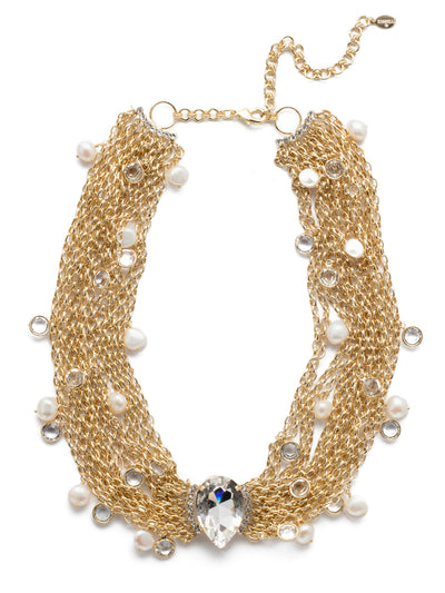 Oceane Classic Statement Necklace - 4NEF3BGMDP - Grounded by a statement pear-shaped crystal, stand out in a crowd with this stunner dotted with circular, two-sided channel crystals and pretty freshwater pearls. From Sorrelli's Modern Pearl collection in our Bright Gold-tone finish.