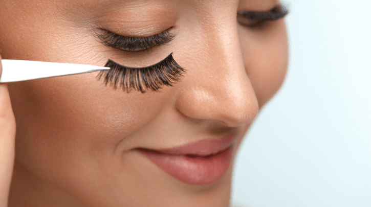 Applying false eyelashes