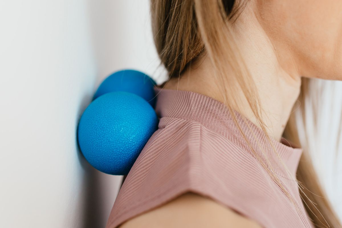 Massage Ball Being Used on the Spine