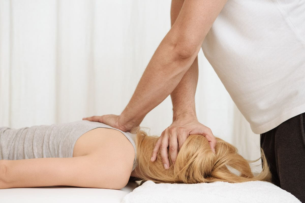 Woman Laying Down While Having a Chiropractic Treatment
