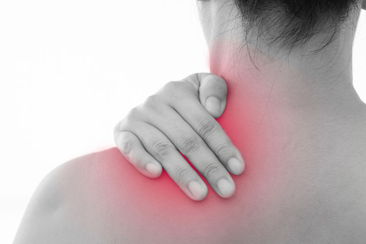 Man Holding Upper Back Because of Pain