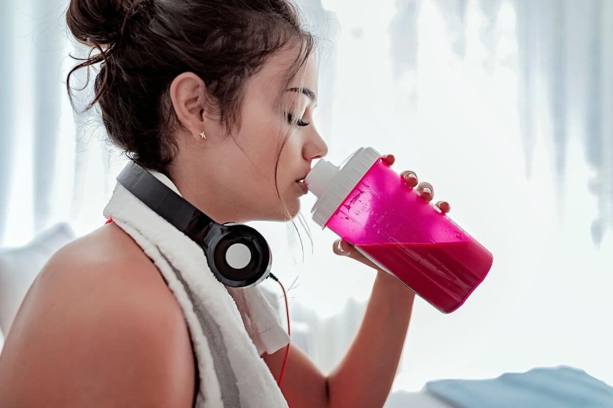 Woman Drinking After Exercising