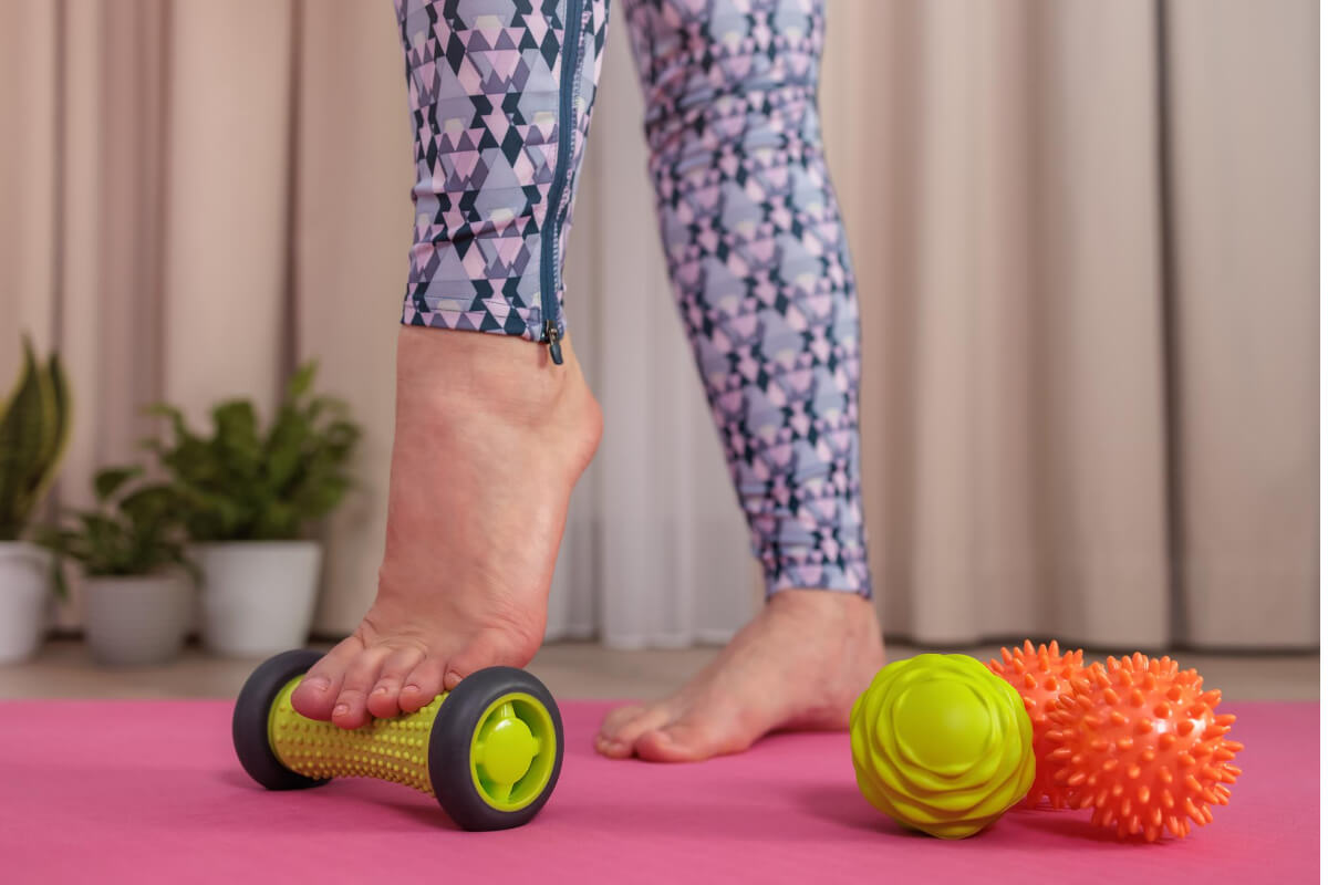 Woman Using a Foot Roller