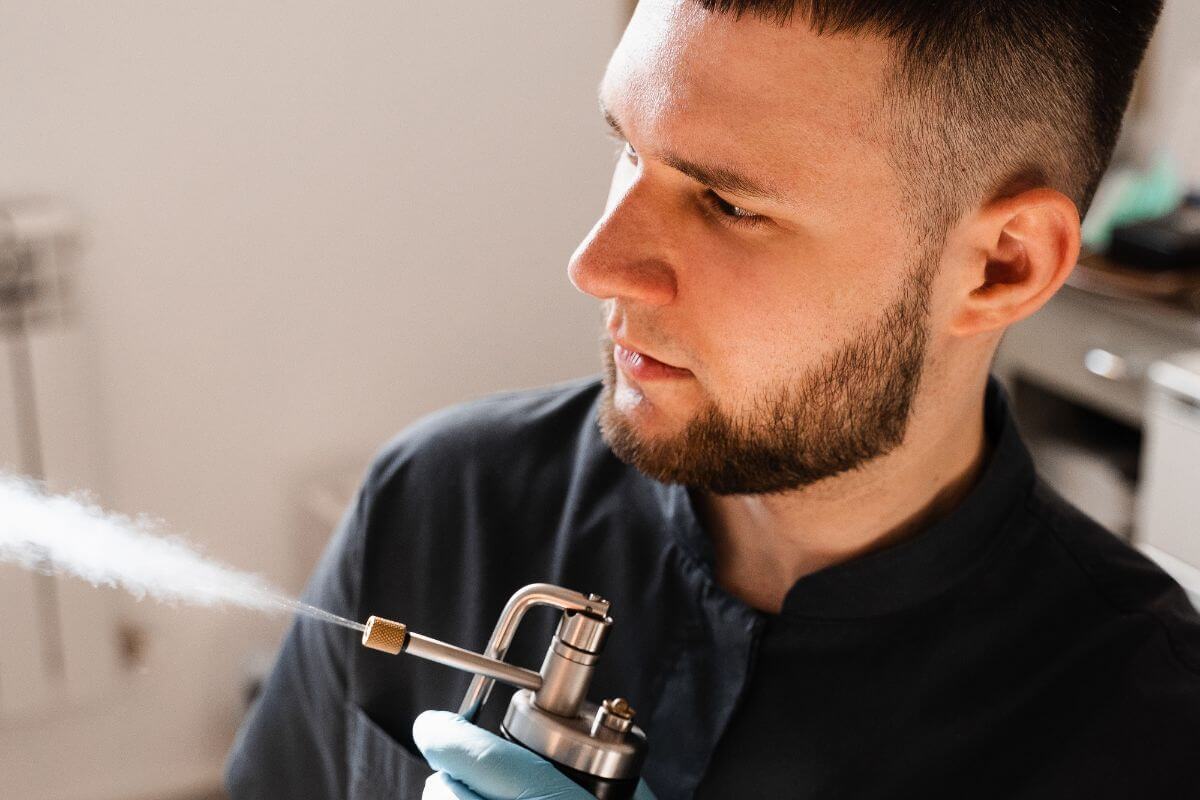 Man Holding Gas Bottle For Cryotherapy