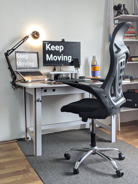 Ergonomic office setup comprising of a highly adjustable mesh chair and a height adjustable desk