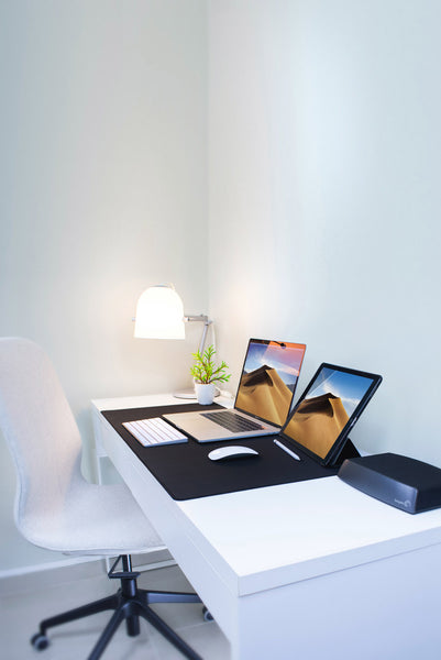 A minimalistic style white office desk in London office.