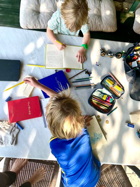 Image of Sara Banks' children journaling using SteamLine Journals