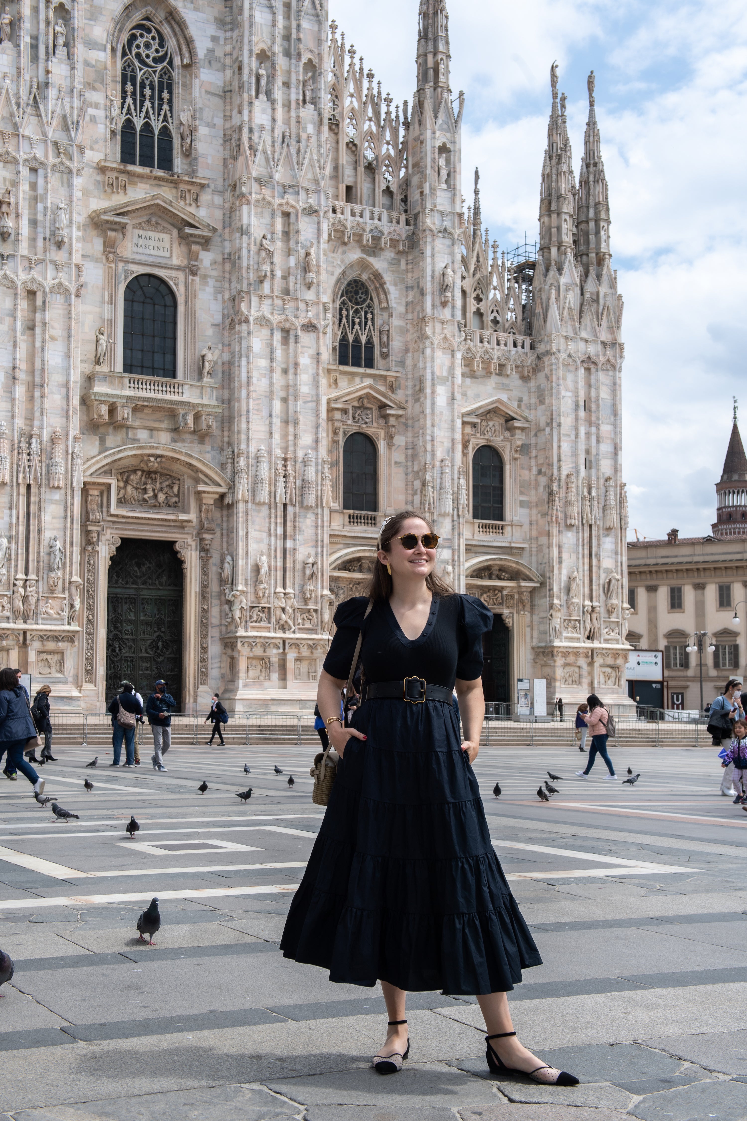 Sarah Flint standing in front of a medieval building