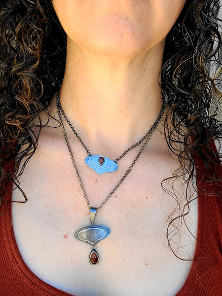 Modeling two layered silver necklaces with carnelian