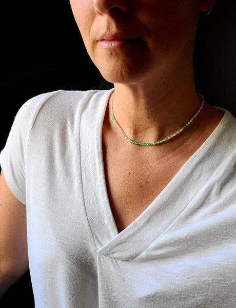 Wearing a chrysoprase and freshwater pearl beaded necklace 