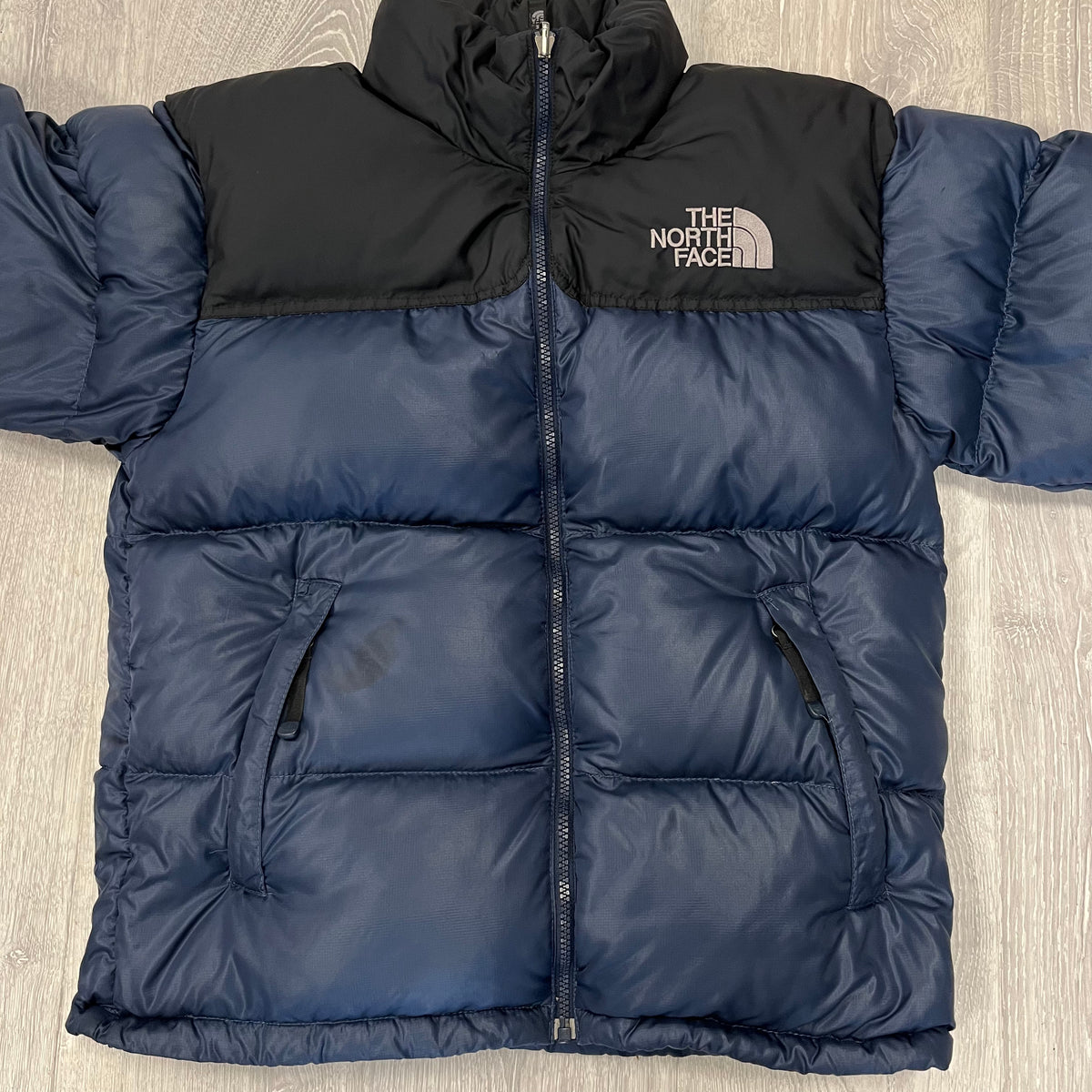 The North Face Navy Blue Puffer Jacket WITH STAIN | We Vintage