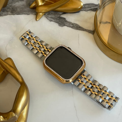 Stainless steel Apple Watch band in silver-gold colours.