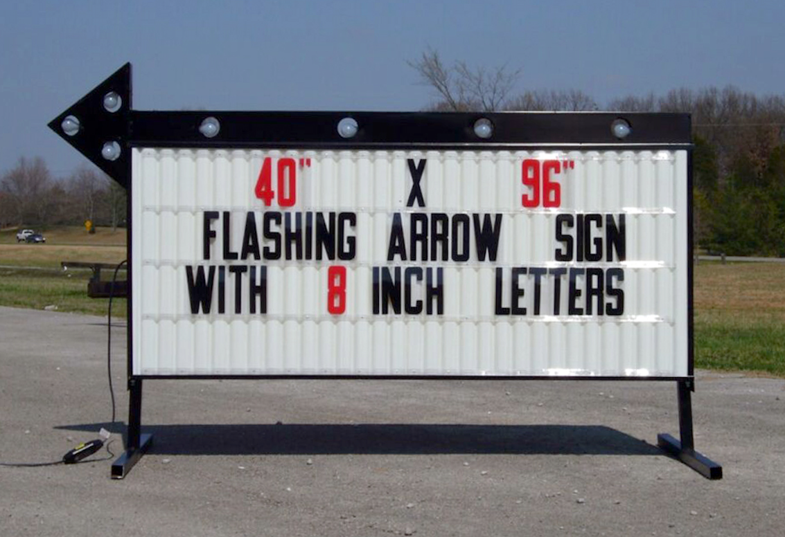 vintage lighted arrow sign