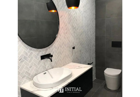 bathroom with herringbone  and concrete look feature tiles