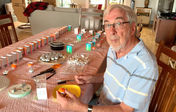 John Conrad, a physics teacher, assembling sensor boards with Sphero Mini.
