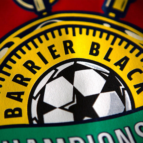 a design of a soccer ball that says barrier black